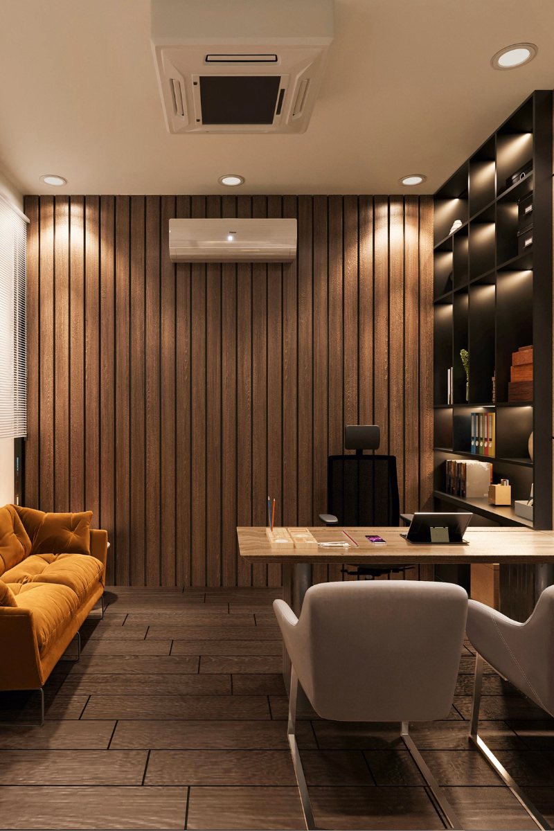 Professional office interior with a desk, guest seating, shelving, and warm lighting in a clean modern workspace